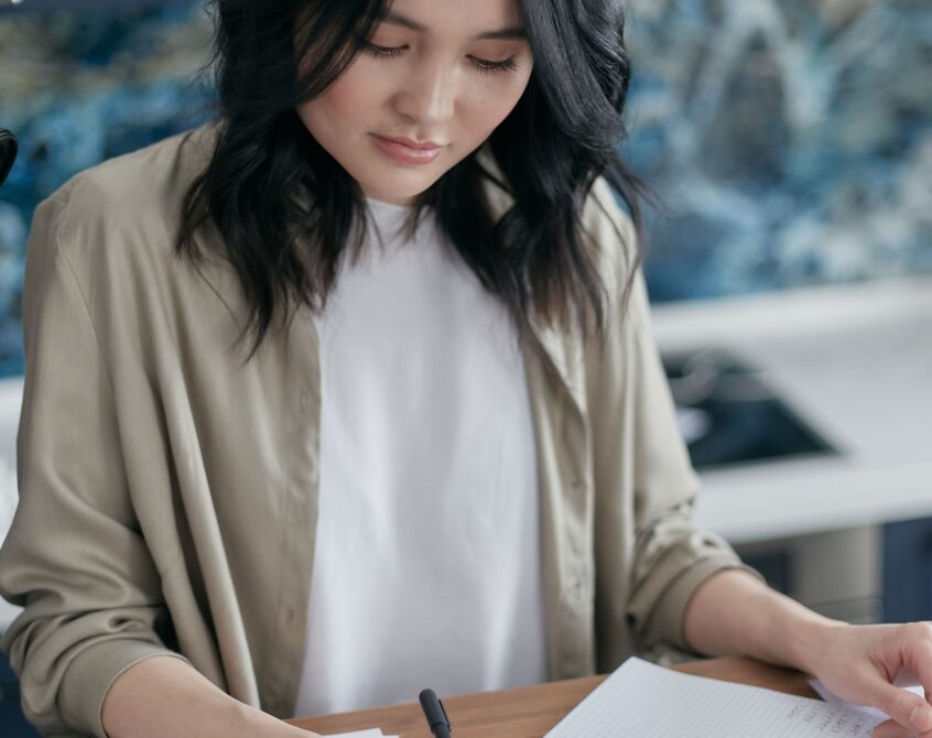 Budgeting with calculator and notebook