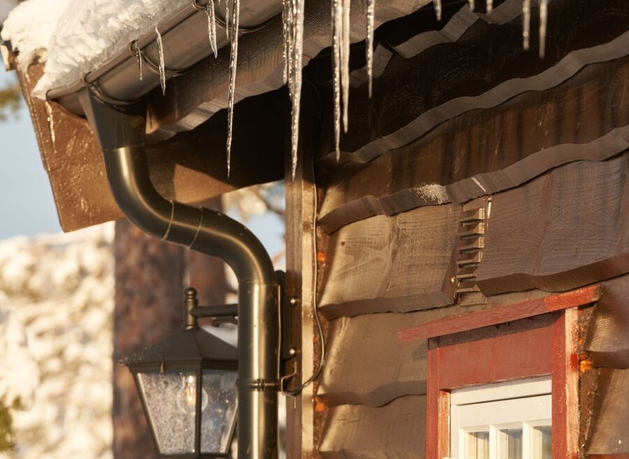 pexels-photo-8875446 Icicles on winter house exterior