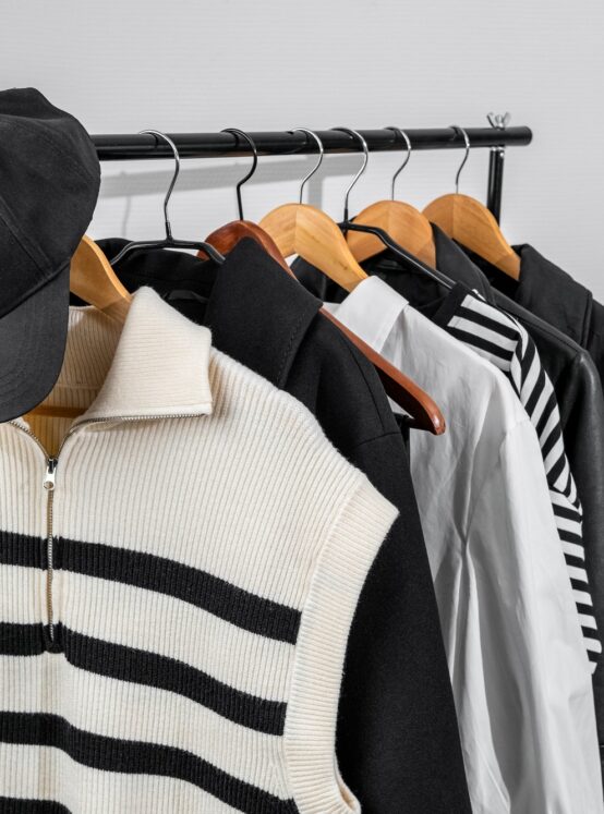 Rack with stylish women's clothes. Capsule minimal wardrobe.